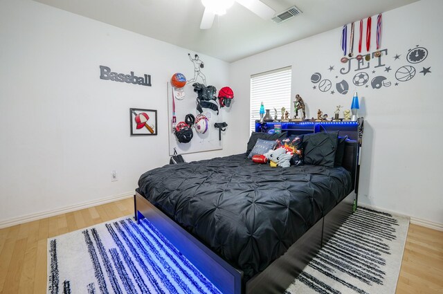 11606 Curry Ridge Ln, Tomball, TX 77377 - bedroom with wood finished floors, ceiling fan, and baseboards