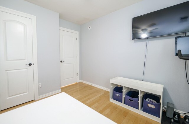 11606 Curry Ridge Ln, Tomball, TX 77377 - bedroom with wood finished floors and baseboards