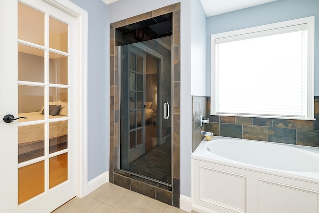 11606 Curry Ridge Ln, Tomball, TX 77377 - full bathroom with a stall shower, a garden tub, and tile patterned flooring