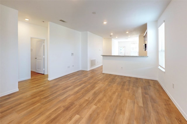 19015 Buckley Oak Dr, New Caney, TX 77357 - spare room with light wood finished floors, plenty of natural light, recessed lighting, and baseboards