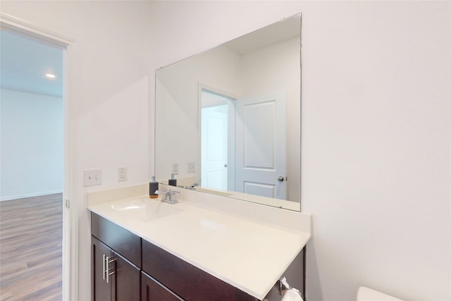 19015 Buckley Oak Dr, New Caney, TX 77357 - bathroom with vanity, wood finished floors, and recessed lighting