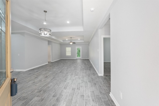 237 Camden Hills Dr, Montgomery, TX 77356 - unfurnished living room featuring a raised ceiling, a ceiling fan, wood finished floors, baseboards, and recessed lighting