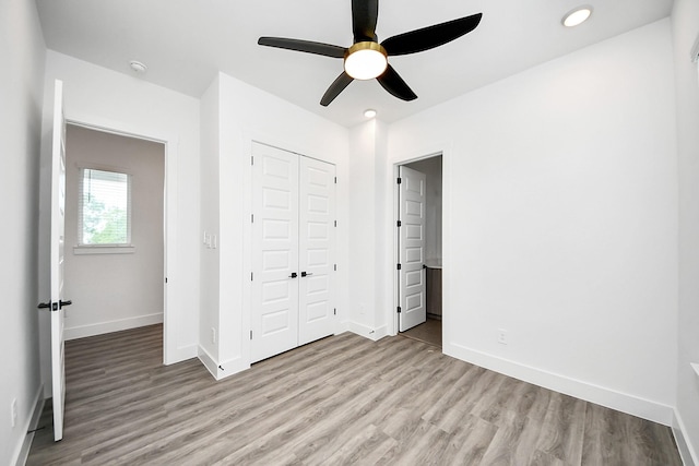 unfurnished bedroom featuring light wood-type flooring, baseboards, a closet, recessed lighting, and ceiling fan