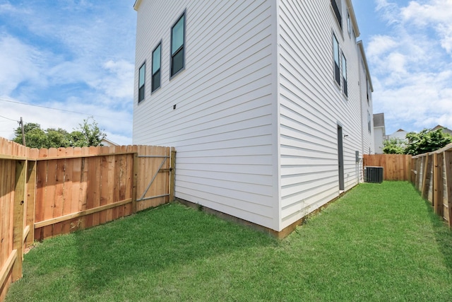 view of side of home featuring central AC unit