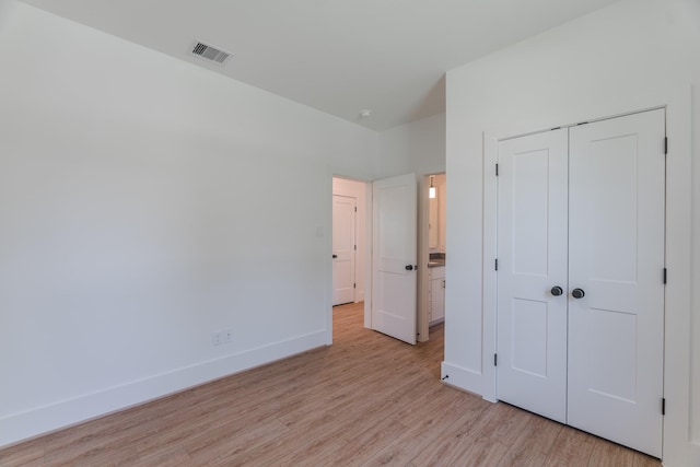 3203 Hemingway Dr, Montgomery, TX 77356 - unfurnished bedroom featuring light wood-style flooring, baseboards, and a closet