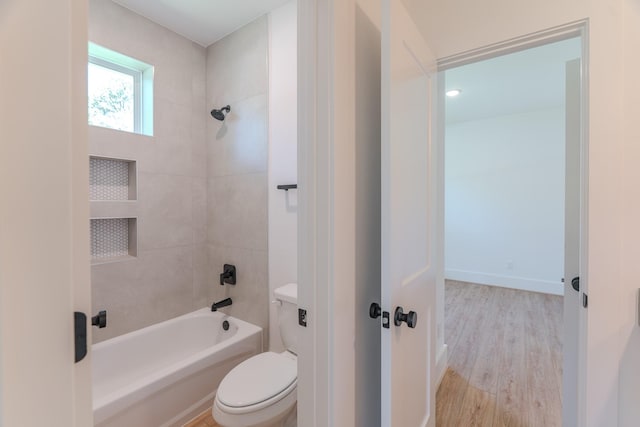 3203 Hemingway Dr, Montgomery, TX 77356 - full bath with toilet, wood finished floors, and bathing tub / shower combination