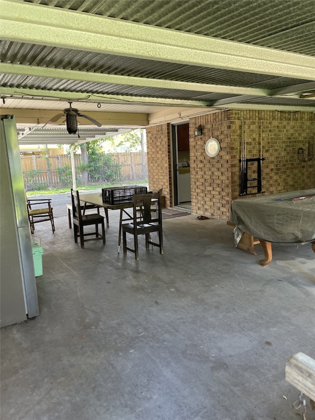 view of patio / terrace featuring outdoor dining space, fence, and ceiling fan