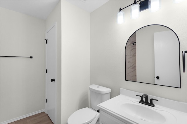 11339 Log Cabin Ln, Tomball, TX 77375 - bathroom featuring wood finished floors, toilet, and vanity