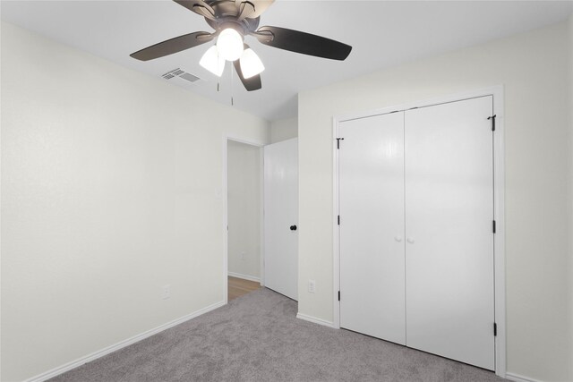 11339 Log Cabin Ln, Tomball, TX 77375 - unfurnished bedroom featuring carpet floors, a closet, a ceiling fan, and baseboards