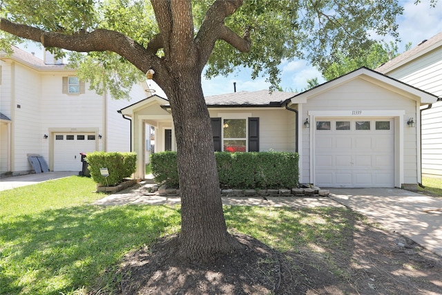 11339 Log Cabin Ln, Tomball, TX 77375 - view of front of home with concrete driveway, an attached garage, and a front lawn