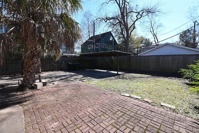 fenced backyard featuring a patio area