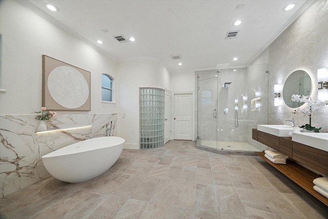 22 Berenger Pl, Sugar Land, TX 77479 - bathroom featuring tile walls, crown molding, a shower stall, recessed lighting, and a freestanding bath