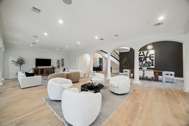 22 Berenger Pl, Sugar Land, TX 77479 - living area featuring decorative columns, arched walkways, baseboards, ornamental molding, and recessed lighting