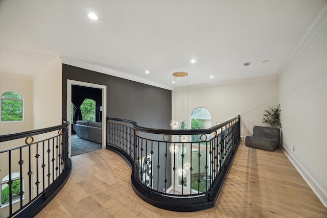 22 Berenger Pl, Sugar Land, TX 77479 - hallway featuring an upstairs landing, wood finished floors, recessed lighting, ornamental molding, and baseboards
