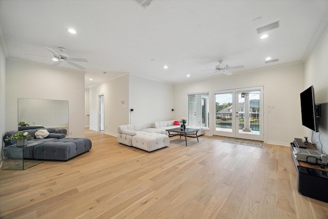 22 Berenger Pl, Sugar Land, TX 77479 - living room featuring ceiling fan, crown molding, light wood-type flooring, french doors, and recessed lighting
