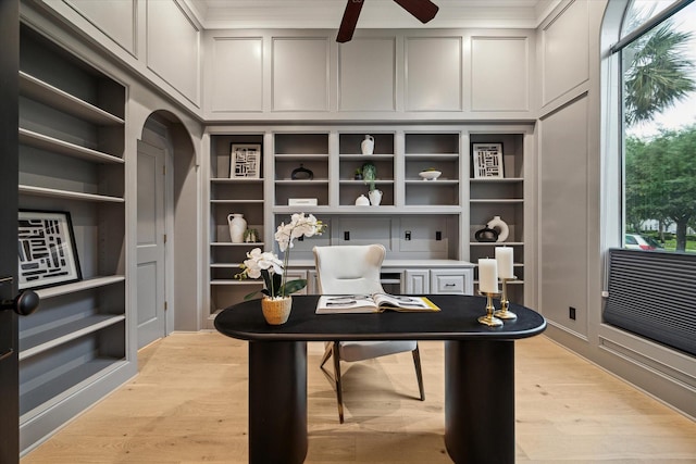 22 Berenger Pl, Sugar Land, TX 77479 - office space with a decorative wall, built in features, ceiling fan, light wood-style flooring, and crown molding
