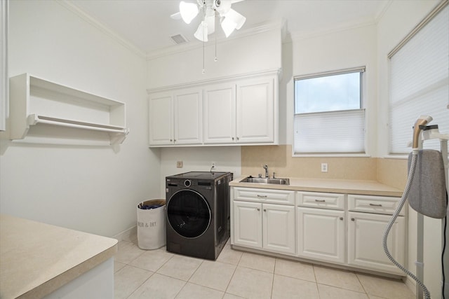 22 Berenger Pl, Sugar Land, TX 77479 - washroom with washer / dryer, cabinet space, a ceiling fan, light tile patterned floors, and crown molding