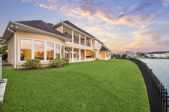 22 Berenger Pl, Sugar Land, TX 77479 - rear view of house featuring a ceiling fan, a patio area, a water view, and stucco siding