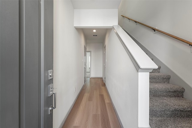 58 Dipping Ln, Houston, TX 77076 - corridor with light wood finished floors, recessed lighting, and stairs