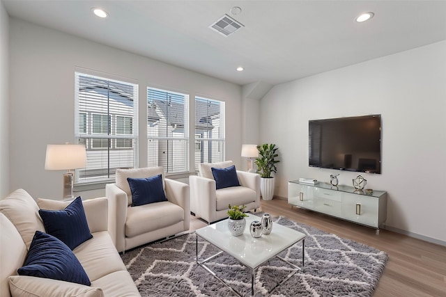 58 Dipping Ln, Houston, TX 77076 - living room with wood finished floors, recessed lighting, and baseboards