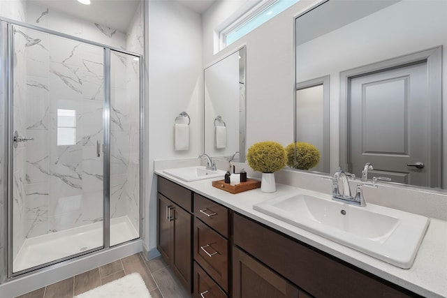 58 Dipping Ln, Houston, TX 77076 - full bathroom featuring a marble finish shower, wood tiled floors, and double vanity