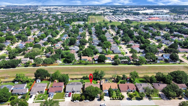 aerial view of property and surrounding area featuring nearby suburban area