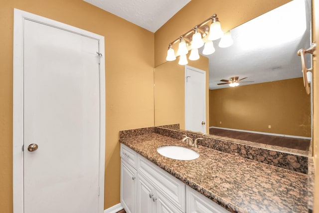 bathroom featuring vanity and ceiling fan