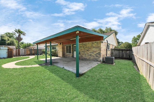 13430 Firebrick Dr, Houston, TX 77041 - back of house featuring a patio area, central AC unit, and brick siding