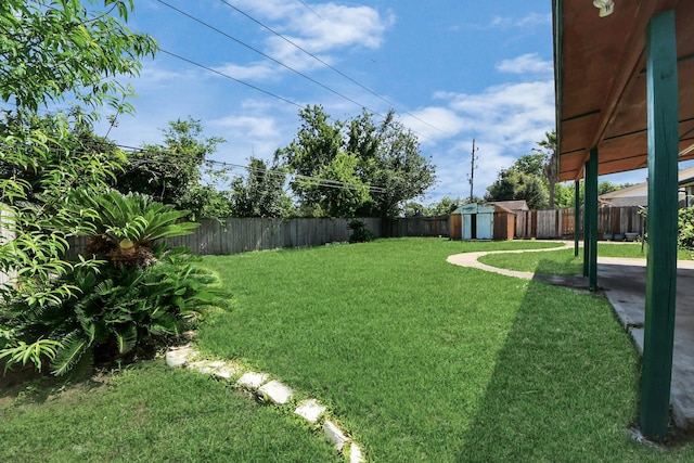 view of yard with a shed and an outdoor structure