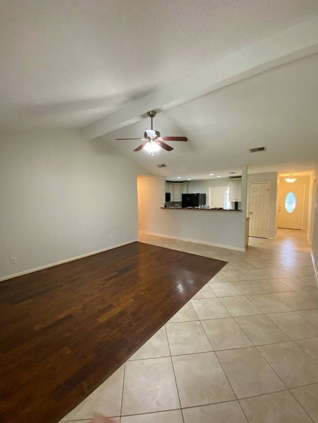 13430 Firebrick Dr, Houston, TX 77041 - unfurnished living room featuring a ceiling fan, tile patterned flooring, and baseboards