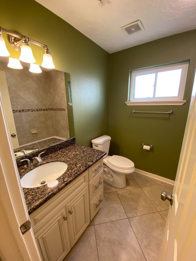13430 Firebrick Dr, Houston, TX 77041 - bathroom featuring vanity, tile patterned flooring, and toilet