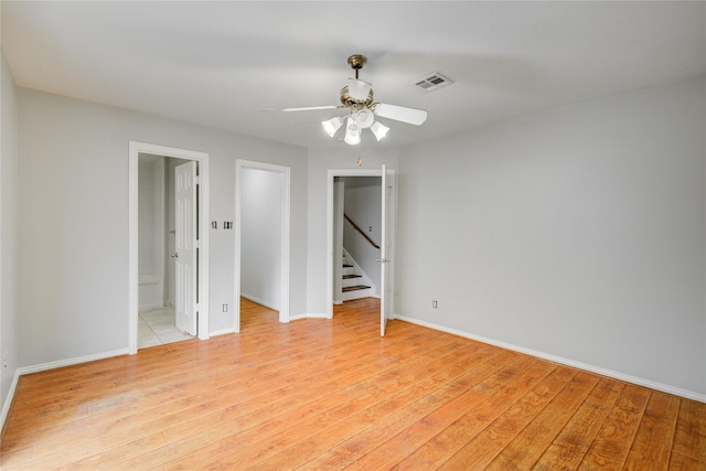 12409 Urban Dale Ct, Houston, TX 77082 - unfurnished room with light wood-type flooring, baseboards, and ceiling fan