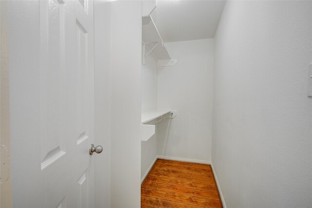 12409 Urban Dale Ct, Houston, TX 77082 - spacious closet with wood finished floors