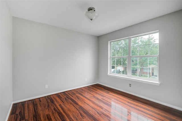 12409 Urban Dale Ct, Houston, TX 77082 - spare room with dark wood-style flooring and baseboards