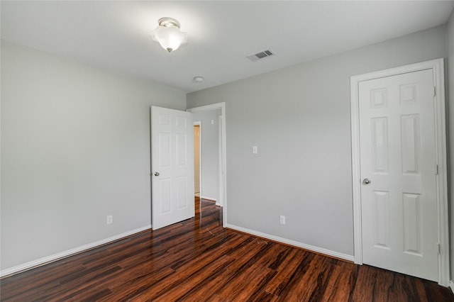12409 Urban Dale Ct, Houston, TX 77082 - unfurnished bedroom with dark wood-style flooring and baseboards