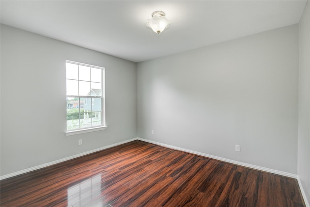 12409 Urban Dale Ct, Houston, TX 77082 - unfurnished room with dark wood-style flooring and baseboards