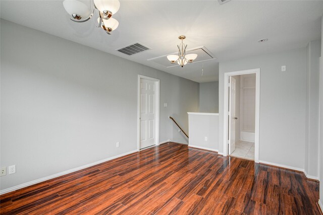 12409 Urban Dale Ct, Houston, TX 77082 - spare room featuring attic access, wood finished floors, and baseboards