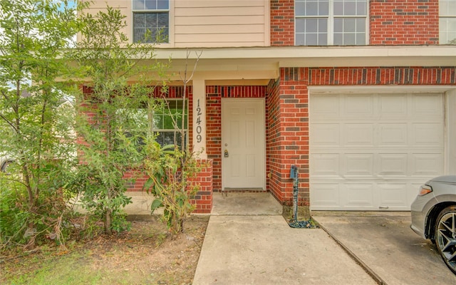 12409 Urban Dale Ct, Houston, TX 77082 - entrance to property with brick siding and an attached garage