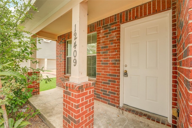 12409 Urban Dale Ct, Houston, TX 77082 - entrance to property with a porch and brick siding