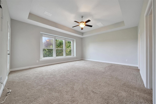 18323 Parkview Point Dr, Houston, TX 77094 - carpeted empty room featuring a raised ceiling, a ceiling fan, and baseboards