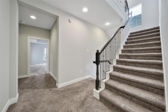 18323 Parkview Point Dr, Houston, TX 77094 - stairs featuring carpet flooring, baseboards, and recessed lighting