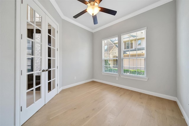 18323 Parkview Point Dr, Houston, TX 77094 - empty room with french doors, plenty of natural light, baseboards, light wood-style flooring, and crown molding