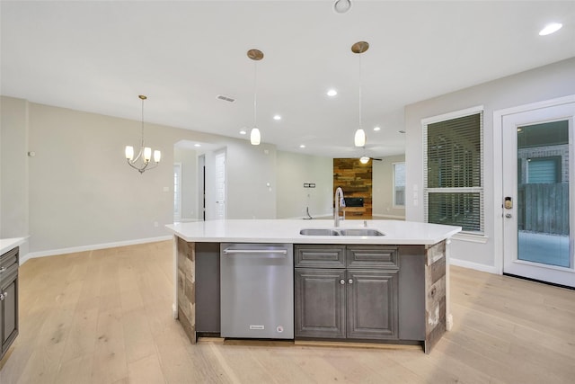 18323 Parkview Point Dr, Houston, TX 77094 - kitchen with a sink, dishwasher, light wood-style flooring, light countertops, and recessed lighting