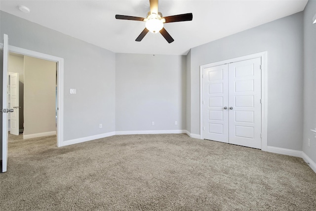18323 Parkview Point Dr, Houston, TX 77094 - unfurnished bedroom with carpet flooring, baseboards, a closet, and a ceiling fan