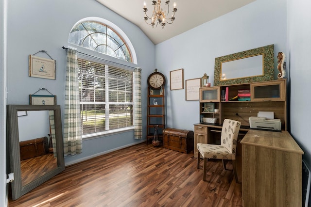 office space featuring a chandelier, lofted ceiling, healthy amount of natural light, wood finished floors, and baseboards