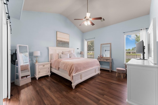 bedroom featuring dark wood-type flooring, lofted ceiling, multiple windows, and a ceiling fan