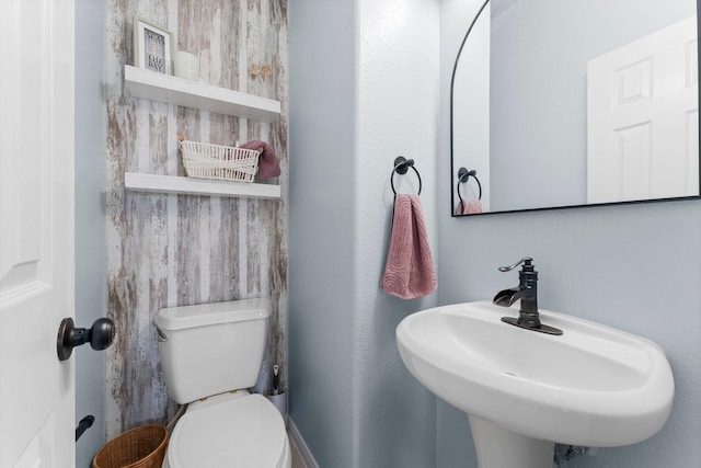 bathroom featuring a sink and toilet
