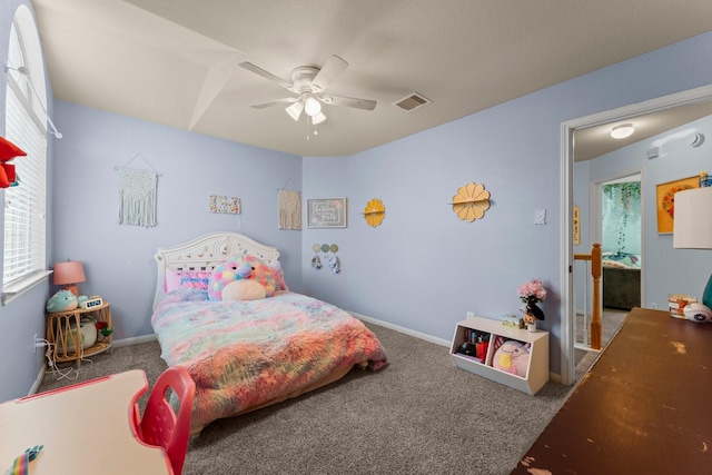 bedroom with carpet, multiple windows, and a ceiling fan