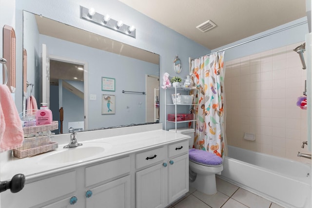 bathroom with tile patterned floors, shower / bath combo, vanity, and toilet