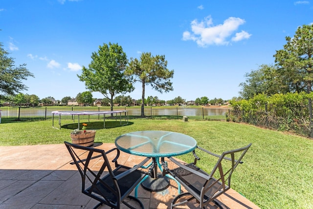 view of patio / terrace featuring a trampoline and a water view